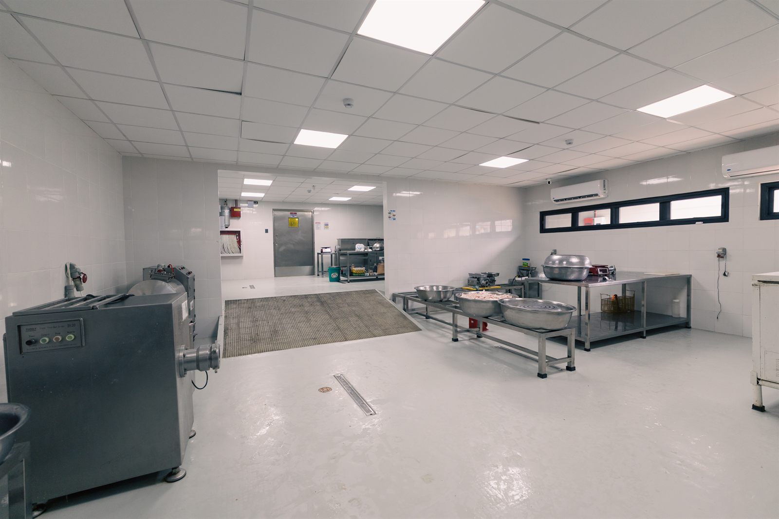 Inside the Kwatogs commissary in Lipa City — a spotless stainless-steel production floor